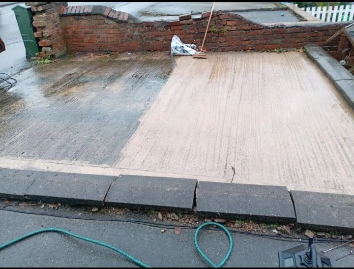 Half-cleaned concrete driveway in Chesterfield showing the dramatic difference one pass of the pressure washer makes